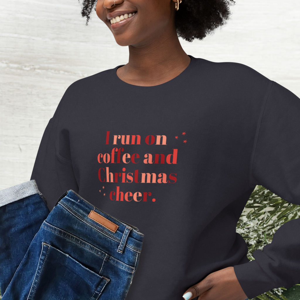 Pretty Christmas Sweatshirt for Women that says I run on coffee and Christmas cheer.